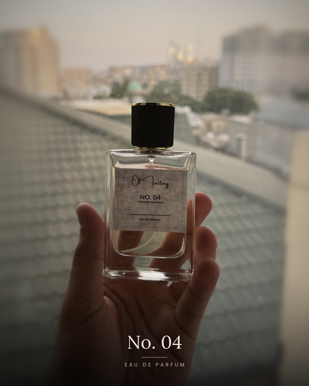 No. 04 Thomas Kosmala inspired perfume by Ol' Factory held in hand